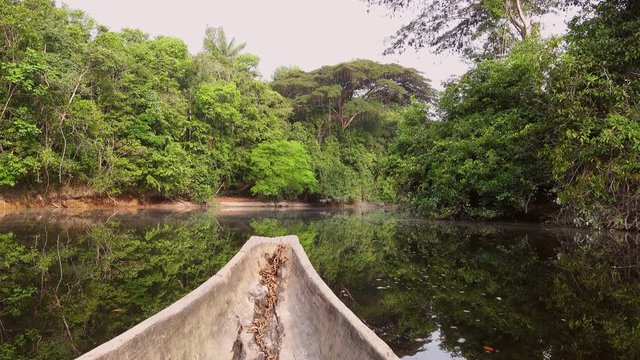 Sailing on Indigenous canoe in Corocoro river. Amazon state Venezuela