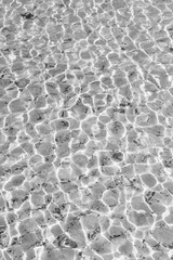 Waves Pattern in crystal clear water on black and white