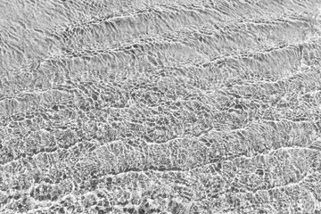 Waves Pattern in crystal clear water on black and white