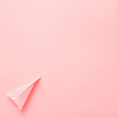 Paper plane on pastel background