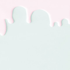 Liquid flowing down concept on pastel background