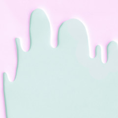 Liquid flowing down concept on pastel background