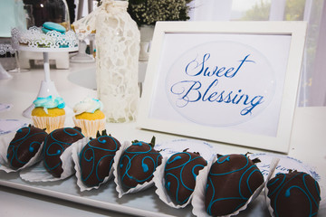 decoration elements for banquets and parties, chocolate, candles, flowers, glasses