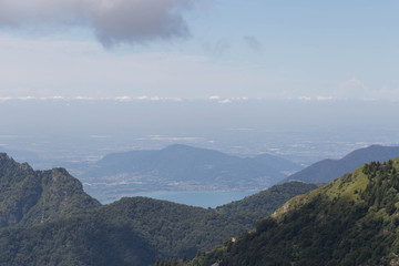 Obraz premium Mountain landscape with lake and plain on backgorund.