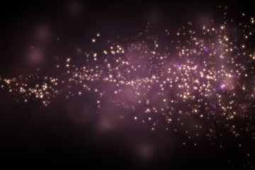 Freeze motion of shiny yellow golden particles exploding scatter