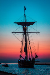 Tall ship sailing in South Haven Michigan during blue hour and sunset