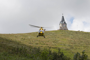 Rescue helicopter above Monte Guglielmo, Lombardy, Italy.