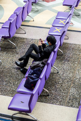 Bangkok, Thailand - Asian people waiting the train keep distance protect from COVID-19