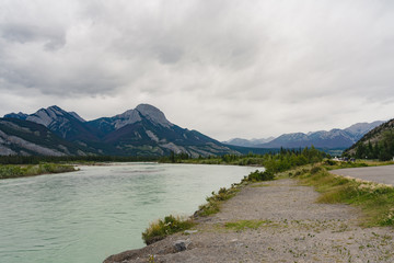 Image of mountains and river during cloudy weather in Jasper National Park in Alberta, Canada
