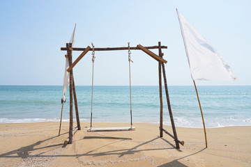 Wooden Swing & Hang Chair on the Beach.