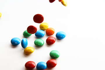 Colorful milk chocolate on white background