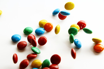Colorful milk chocolate on white background
