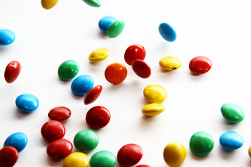 Colorful milk chocolate on white background