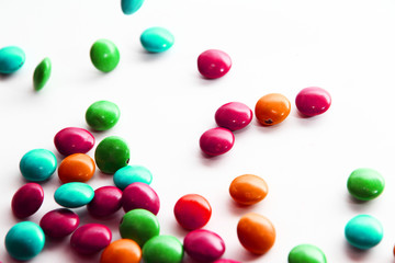 Colorful milk chocolate on white background