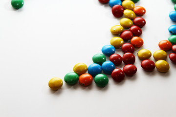 Colorful milk chocolate on white background