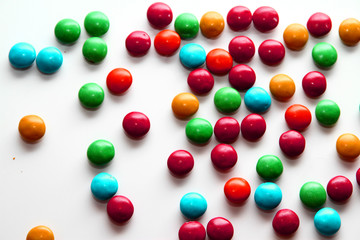 Colorful milk chocolate on white background