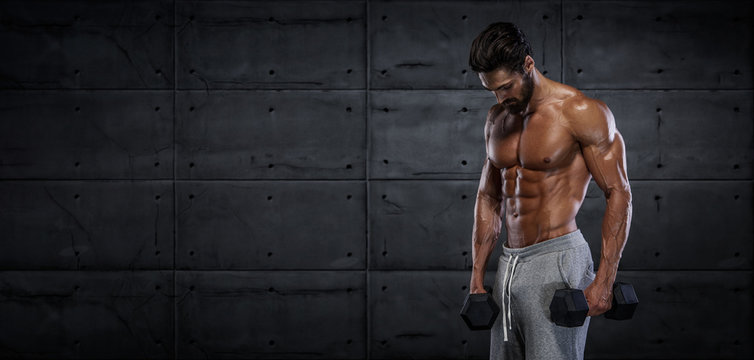 Handsome Muscular Men, Bodybuilder Training With Dumbbells. Copy Space
