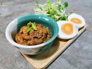 Crab Chili Paste in mini green cup with Boiled Eggs , Vegetable on wooden plate