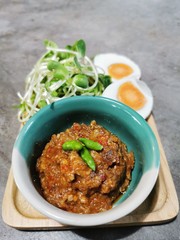 Crab Chili Paste in mini green cup with Boiled Eggs , Vegetable on wooden plate