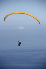 paragliding in the blue sky