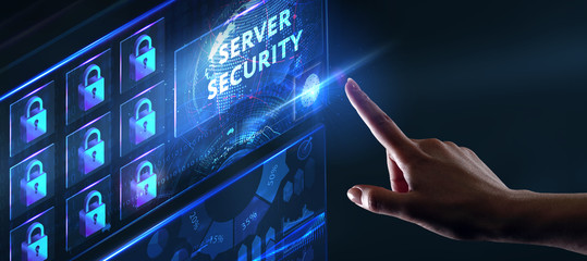 Business, technology, internet and networking concept. Young businessman working in the office, select the icon Server security  on the virtual display.
