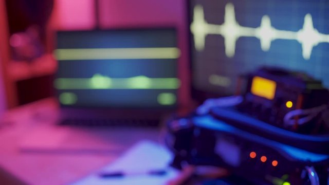 Control room - Hand counts down from three to one - sound devices and mixers in studio