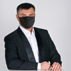 Portrait of confident businessman on grey background. photo with a square aspect ratio. man wearing...