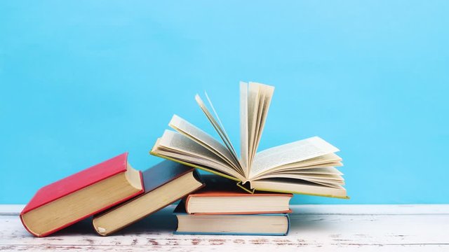 Pile of colored books on the table - Stop motion 