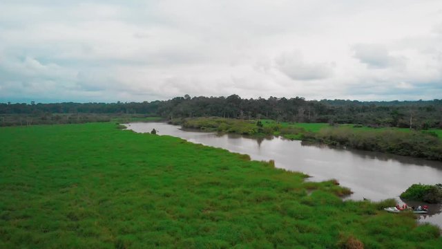 Beautiful scenery with green plains by the river in Loango National Park, drone shot in Gabon