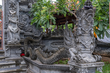 Balinese temple with decorations and statues