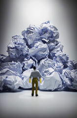 The mna Facing with problem and obstacle,crumpled paper  heap with man Figure