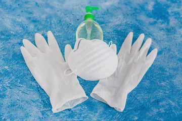 personal hygiene against virus outbreaks like covid-19, disposable gloves with face mask and hand sanitizer as essential items for health safety