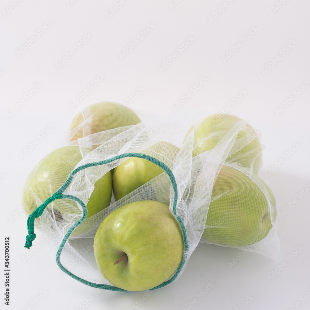 Wall mural zero waste, plastic free recycled textile produce bag for carrying fruit apples or vegetables, a whi