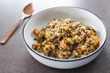 plant-based food, vegan ginger quinoa salad with chopped celeri onion and carrot