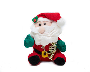 fabric Santa Claus Christmas decoration on white background, plush santa holding a golden horn
