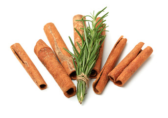 Cinnamon and rosemary on a white background