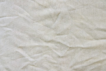 Crumpled white linen fabric cotton for wallpaper design. Brown weave cotton background texture.