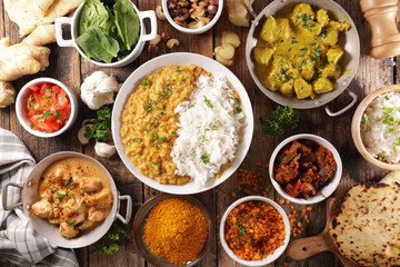 assorted of indian food- chicken tikka masala, curry lentil dal, naan bread