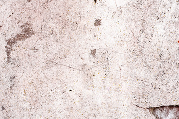Texture of a concrete wall with cracks and scratches which can be used as a background