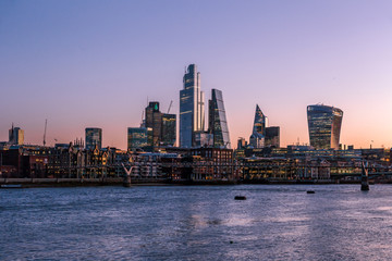 Sunrise view of London skyline and skyscrapers, from across the River Thames