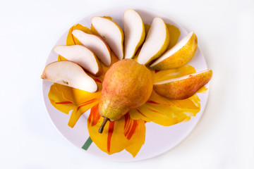 Obraz na płótnie Canvas fresh pear sliced ​​on a plate