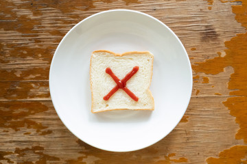 bread of breakfast is written Multiplication sign by ketchup on write plate. A to Z and Number and Special characters set.