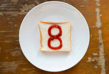 bread of breakfast is written number 8 by ketchup on write plate. A to Z and Number and Special characters set.