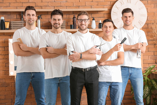 Young men with professional hairdresser during courses in salon
