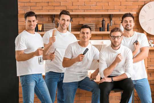 Young men with professional hairdresser during courses in salon