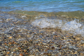 Sea surf on a stony shore.