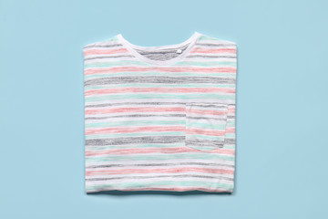 Stylish t-shirt on color background