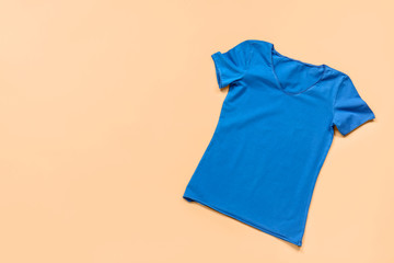 Stylish t-shirt on color background