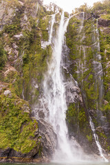 Waterfall at Milford sound  in New Zealand. South Island.