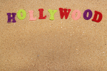 inscription hollywood in the sand, close-up